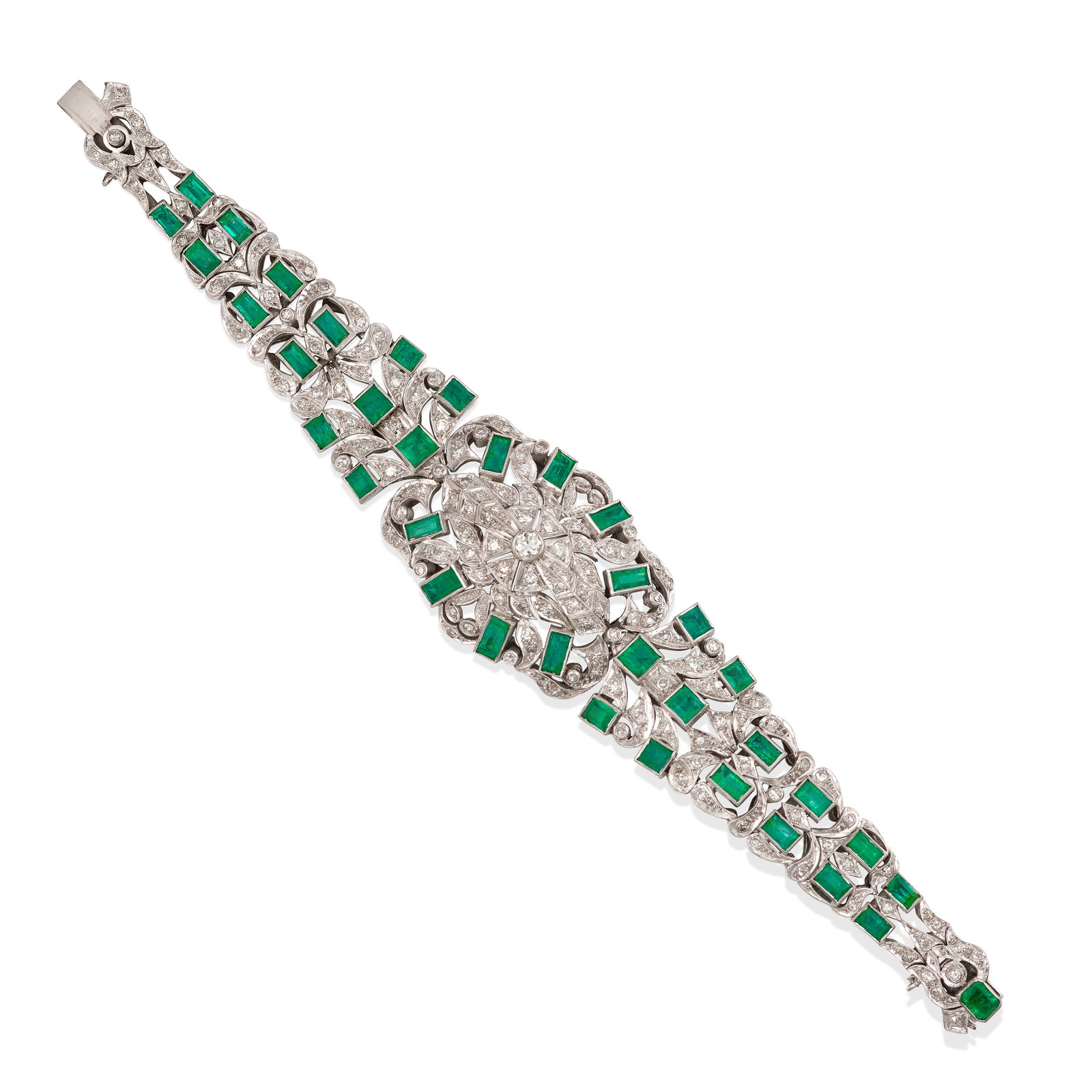 AN EMERALD AND DIAMOND BRACELET: AN EMERALD AND DIAMOND BRACELET Of ornate, openwork design, set across with square and baguette step-cut emeralds, accented with round brilliant and single-cut diamonds; estimated total emerald