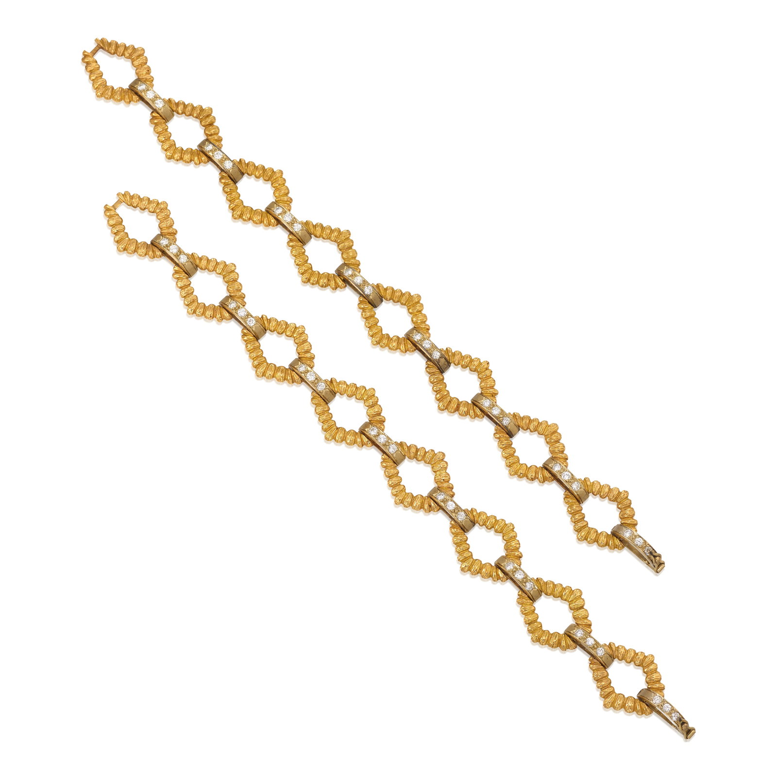 A PAIR OF 18K BICOLOR GOLD AND DIAMOND CONVERTIBLE BRACELETS: A PAIR OF 18K BICOLOR GOLD AND DIAMOND CONVERTIBLE BRACELETS Each of geometric design, accented with round brilliant-cut diamonds, designed to additionally be worn together as a linked collar