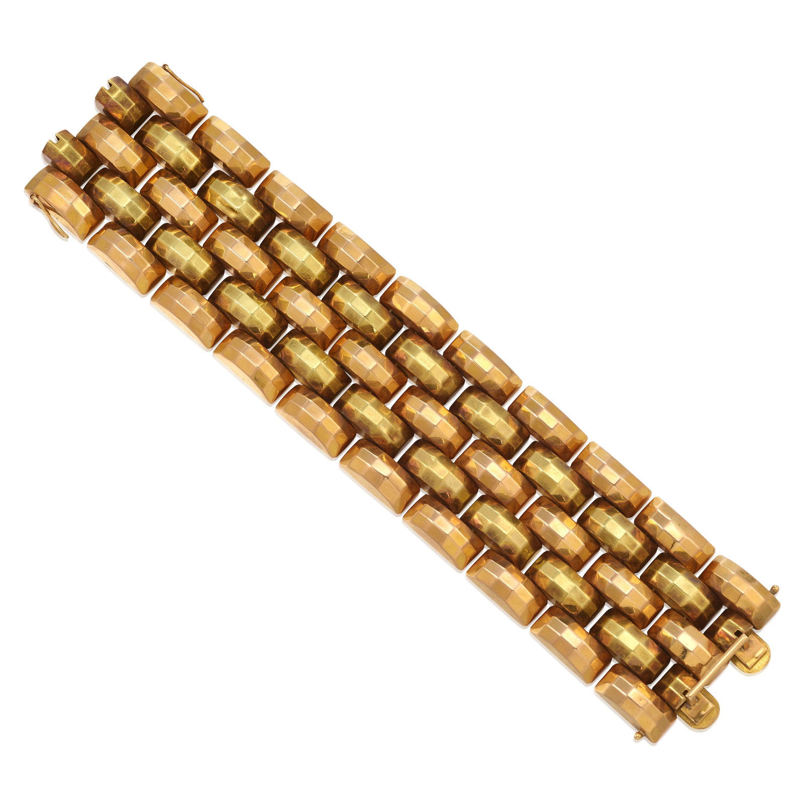 AN 18K BICOLOR GOLD BRACELET, CIRCA 1940: AN 18K BICOLOR GOLD BRACELET, CIRCA 1940 Of brick link design, comprising faceted and domed elements; length 7 3/4 in.; width 1 11/16 in. Footnotes: OVERALL CONDITION: Metal stamped and tested with