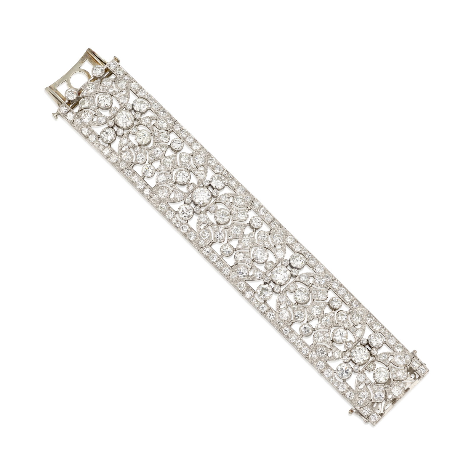 A PLATINUM AND DIAMOND BRACELET, CIRCA 1920: A PLATINUM AND DIAMOND BRACELET, CIRCA 1920 A wide strap bracelet of openwork design, set across with transitional, old European, old mine and single-cut diamonds; with partial maker's mark; with