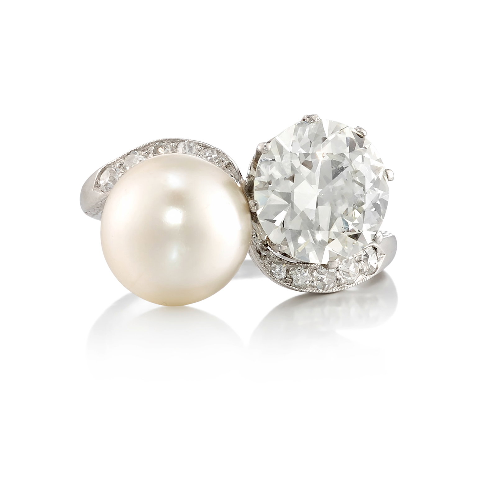 A NATURAL PEARL AND DIAMOND RING, CIRCA 1900: A NATURAL PEARL AND DIAMOND RING, CIRCA 1900 Comprising a button-shaped, natural pearl, a circular brilliant-cut diamond weighing 1.96 carats, accented with single-cut diamonds; mounted in platinum; s
