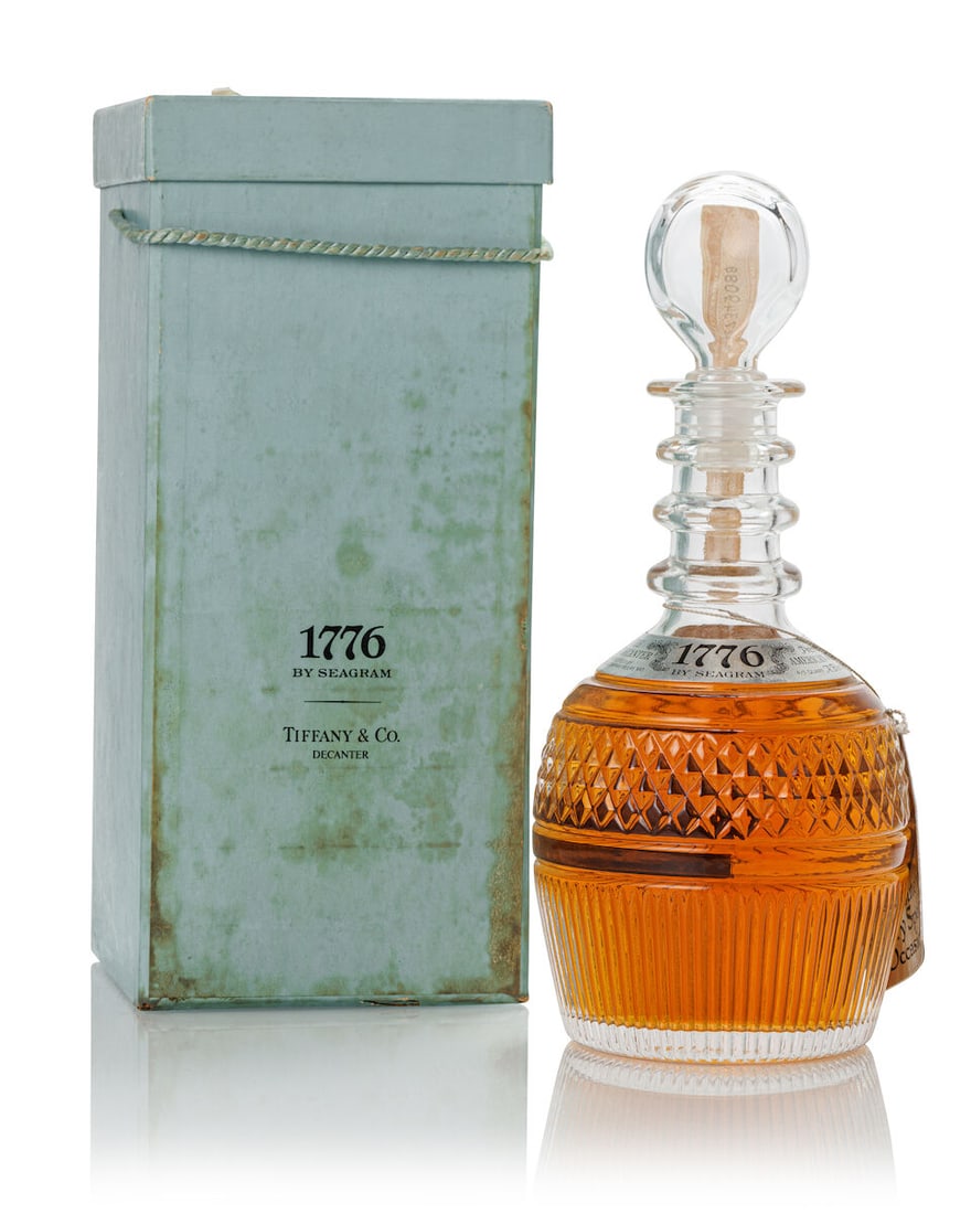 Seagram's 1776 Tiffany Crystal Decanter (1x 4/5 Quart): Seagram's 1776 Tiffany Crystal Decanter (1x 4/5 Quart) Region: United States Label: scuffed labelling Packaging: heavily stained and scuffed original carton Alcohol content: 80 degree proof Notes: Ble
