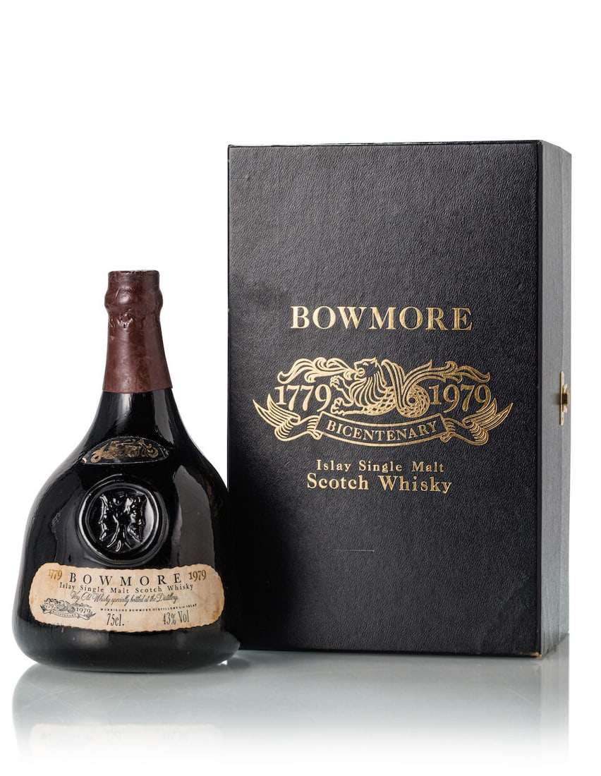 Bowmore Bicentenary (1x filled to 750ml): Bowmore Bicentenary (1x filled to 750ml) Region: Islay Capsule: dented wax capsule Label: bin-soiled and stained label Packaging: in slightly torn and label tapped presentation box, without stopper. M