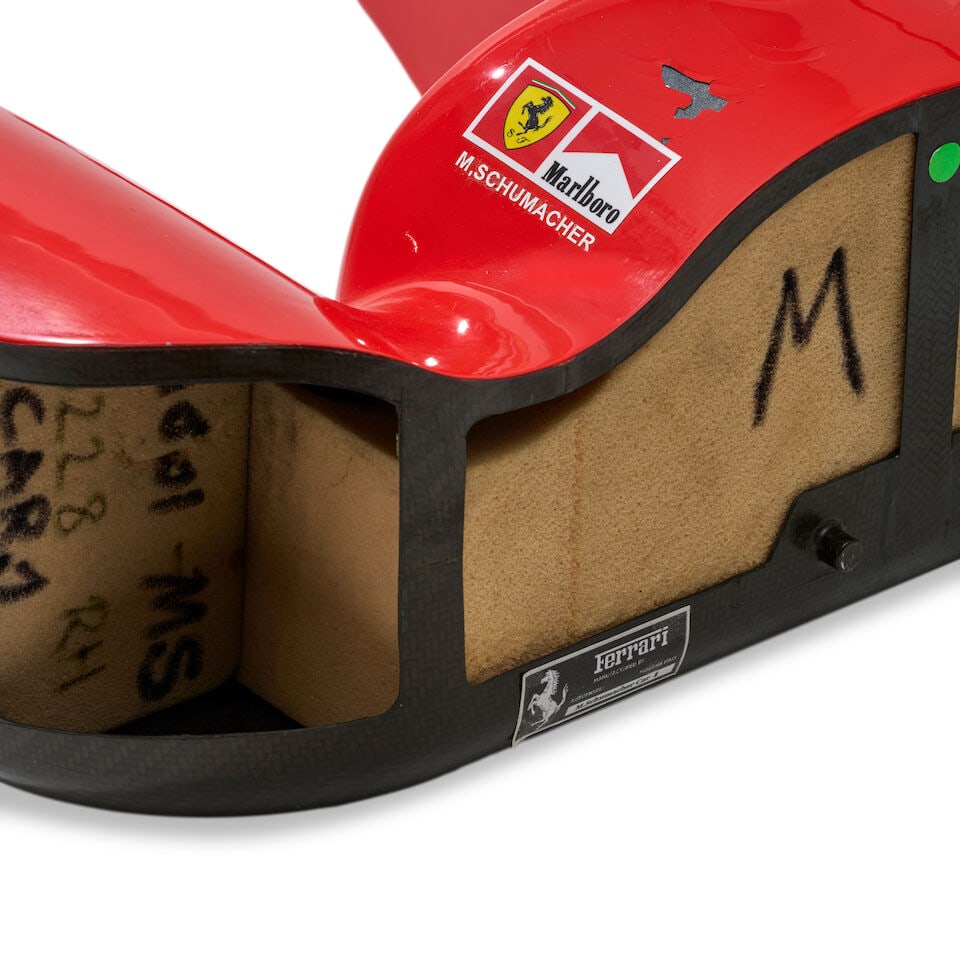 A Scuderia Ferrari F2004 F1 headrest signed by Michael Schumacher, - 3