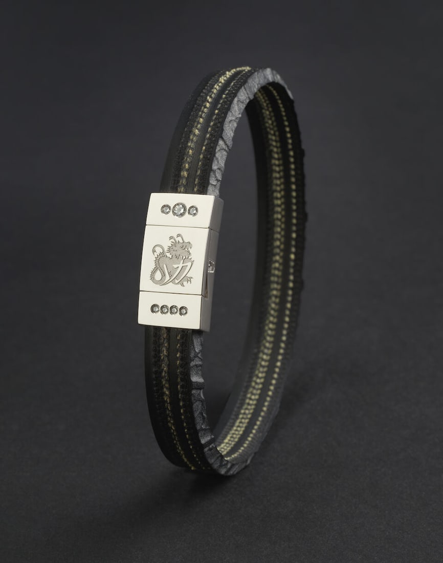A Michael Schumacher 1996 Monza Grand Prix MZ96 'Legend' limited edition bracelet by MONGRIPT...: A Michael Schumacher 1996 Monza Grand Prix MZ96 'Legend' limited edition bracelet by MONGRIP™ under licence from the Keep Fighting Foundation, limited edition number MZ96_001 of 91 (to