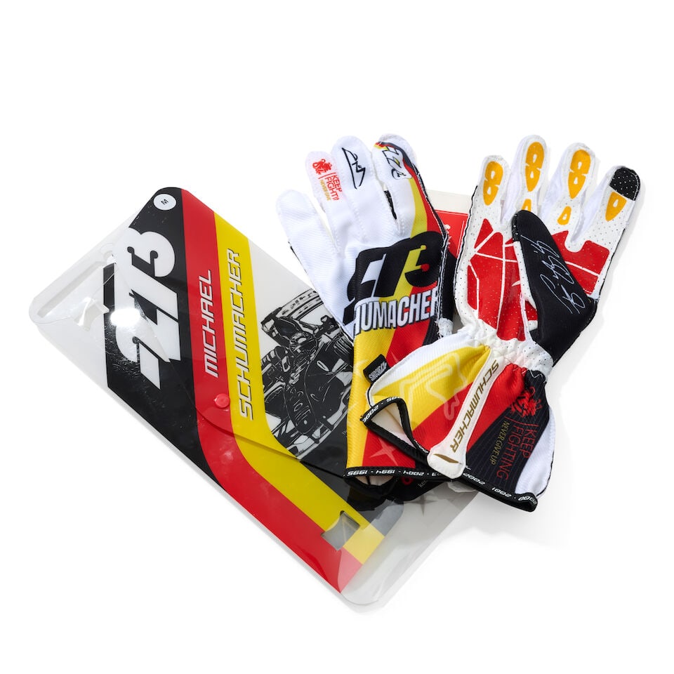 A Pair of Michael Schumacher x 273 Icons Limited edition racing gloves, signed by Mick Schumacher,: A Pair of Michael Schumacher x 273 Icons Limited edition racing gloves, signed by Mick Schumacher, limited edition, signed by Mick Schumacher to the case in silver marker, size M, numbered 001/470.