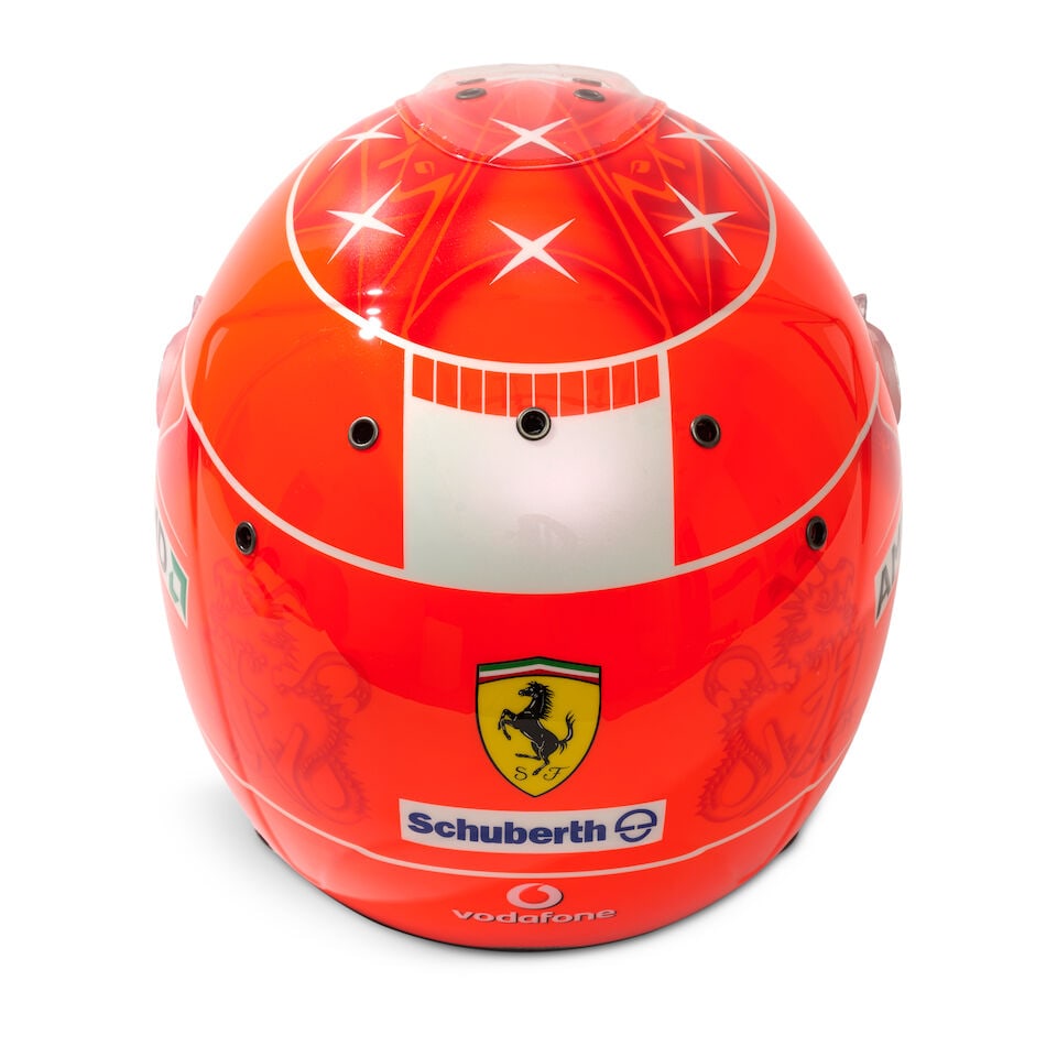 A Michael Schumacher Ferrari F1 2007 'mechanics' helmet, specially commissioned by Schumacher fo... - 2