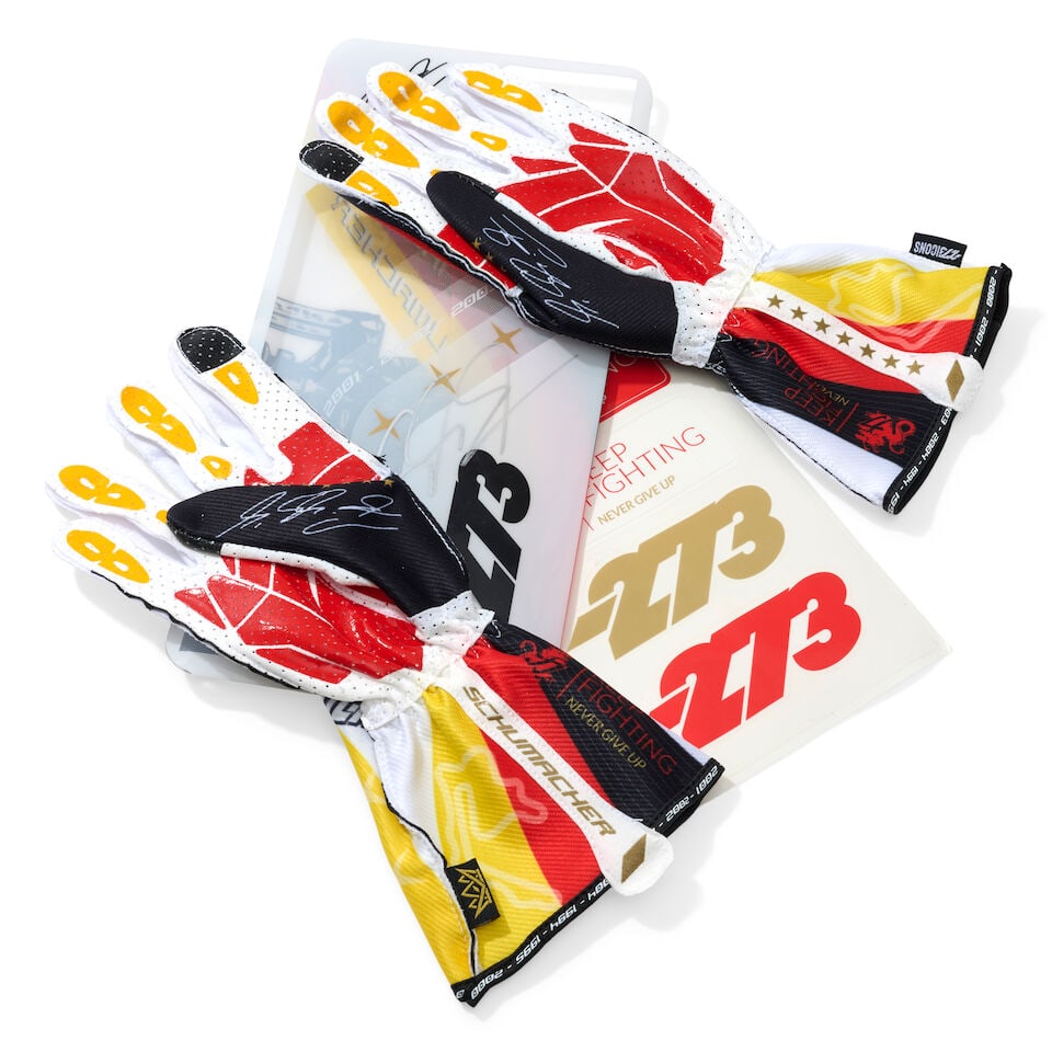 A Pair of Michael Schumacher x 273 Icons Limited edition racing gloves, signed by Mick Schumacher,: A Pair of Michael Schumacher x 273 Icons Limited edition racing gloves, signed by Mick Schumacher, limited edition, signed by Mick Schumacher to the case in silver marker, size M, numbered 006/470.