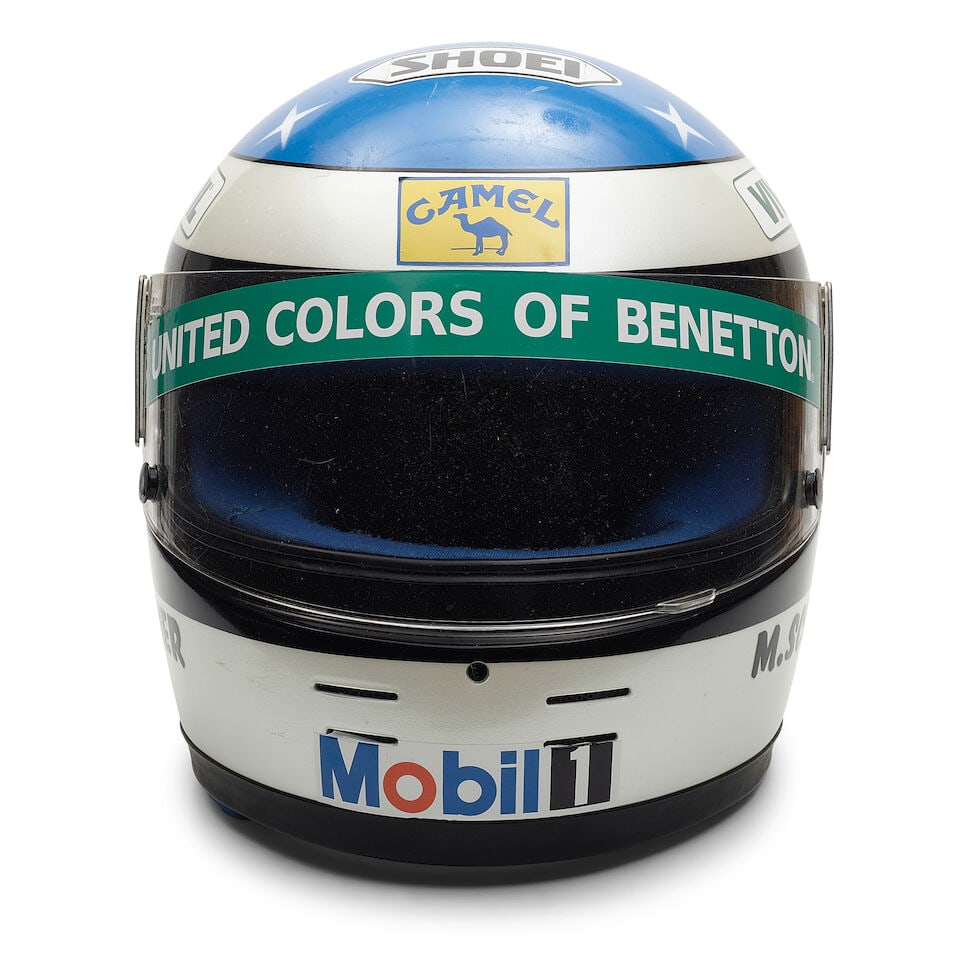 Michael Schumacher's 1991 used helmet, by Shoei,: Michael Schumacher's 1991 used helmet, by Shoei, Believed used during Schumacher's early career racing karts and possibly for DTM in 1991, with sponsors stickers later applied to resemble Schumacher's