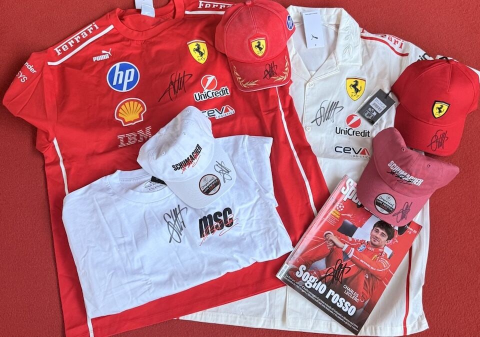 An assorted lot of Scuderia Ferrari Monza exclusive and Schumacher Lounge merchandise, all signe...: Proceeds to benefit The Keep Fighting Foundation An assorted lot of Scuderia Ferrari Monza exclusive and Schumacher Lounge merchandise, all signed by Sebastian Vettel, comprising a red Scuderia