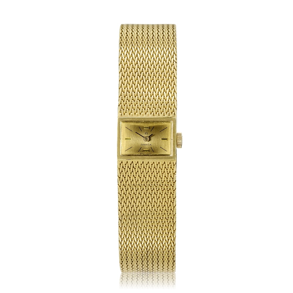 Omega. A lady's 18K gold manual wind bracelet watch Ref: 8109, London Import mark for 1965: Omega. A lady's 18K gold manual wind bracelet watch Reference: 8109 Date: London Import mark for 1965 Movement: 17-jewel Cal.484 manual wind, No.22799930 Dial: Champagne, black baton hour markers with