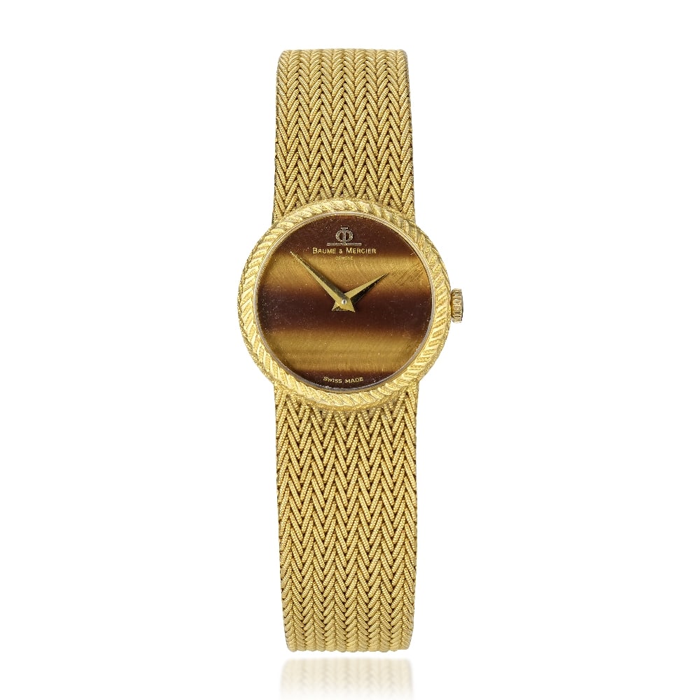 Baume & Mercier. A lady's 18K gold manual wind bracelet watch with Tiger's Eye dial Ref: 36662, ...: Baume & Mercier. A lady's 18K gold manual wind bracelet watch with Tiger's Eye dial Reference: 36662 Date: Birmingham Import mark for 1976 Movement: 17-jewel Cal.775 manual wind Dial: Tiger's Eye, gil