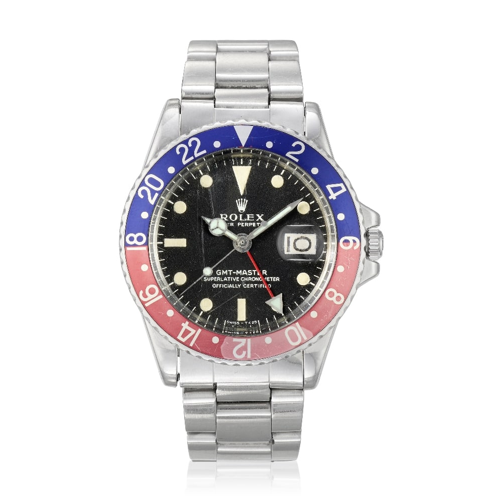 Rolex. A stainless steel automatic calendar bracelet watch with dual time zone GMT-Master, Ref:...: Rolex. A stainless steel automatic calendar bracelet watch with dual time zone Model: GMT-Master Reference: 1675 Date: Circa 1971 Movement: 26-jewel Cal.1570 automatic, No.D648277 Dial: Black, luminou