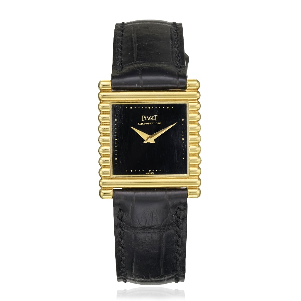 Piaget. An 18K gold quartz wristwatch Ref: 71310, Circa 1980: Piaget. An 18K gold quartz wristwatch Reference: 71310 Date: Circa 1980 Movement: 4-jewel Cal.757P quartz, No.0300450 Dial: Black, gilt dot outer minute divisions, gilt lance hands Case: Brushed and p