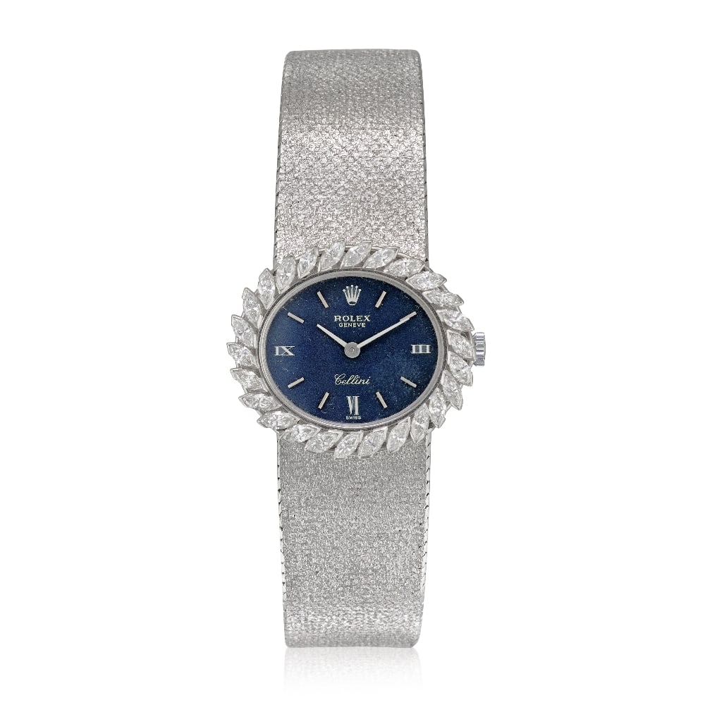 Rolex. A lady's 18K white gold diamond set manual wind bracelet watch Cellini, Circa 1970: Rolex. A lady's 18K white gold diamond set manual wind bracelet watch Model: Cellini Date: Circa 1970 Movement: 19-jewel Cal.1600 manual wind Dial: Blue, applied polished baton hour markers with Roman