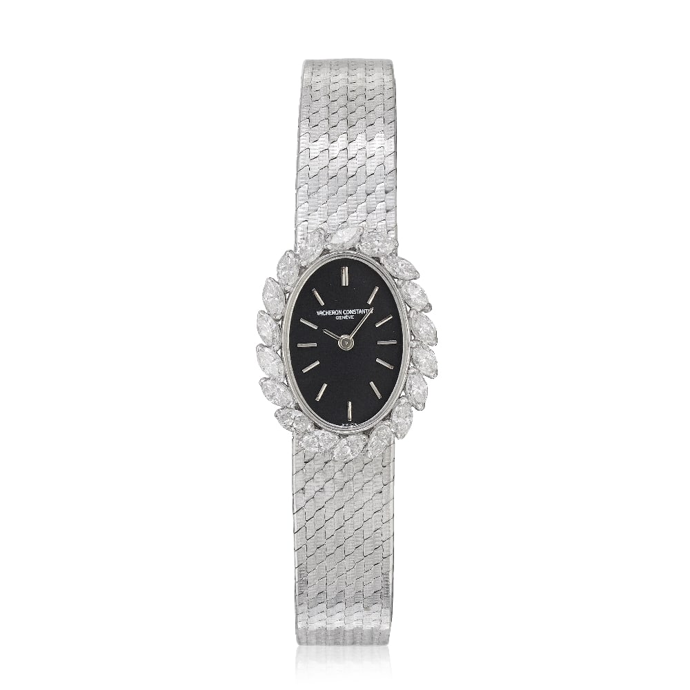 Vacheron Constantin. A lady's 18K white gold diamond set manual wind bracelet watch Ref: 1122, P...: Vacheron Constantin. A lady's 18K white gold diamond set manual wind bracelet watch Reference: 1122 Date: Purchased 24th December 1974 Movement: 18-jewel Cal.1430 manual wind, No.626633 Dial: Black, a