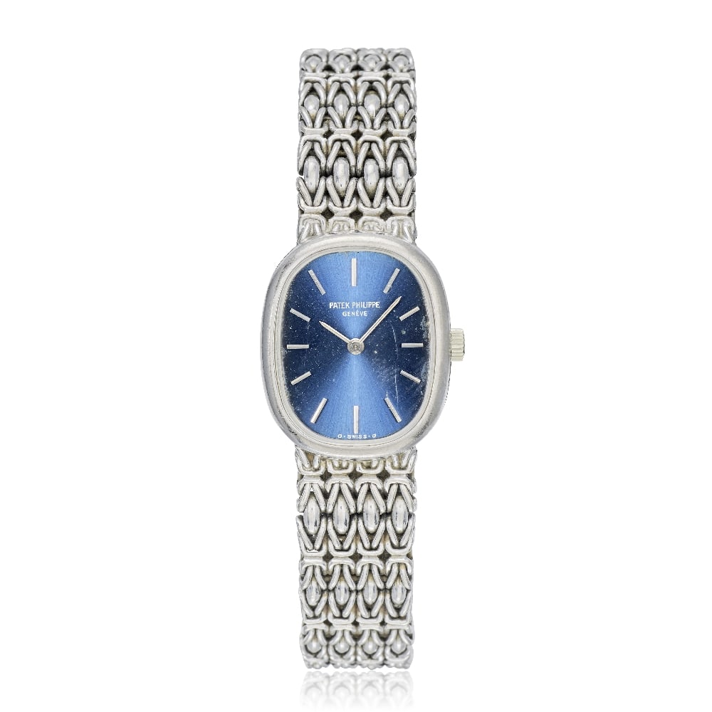 Patek Philippe. A lady's 18K white gold manual wind bracelet watch with sigma dial Ellipse, Ref...: Patek Philippe. A lady's 18K white gold manual wind bracelet watch with sigma dial Model: Ellipse Reference: 4464/1 Date: Circa 1980 Movement: 18-jewel Cal.16-250 manual wind, adjusted to heat, cold, 