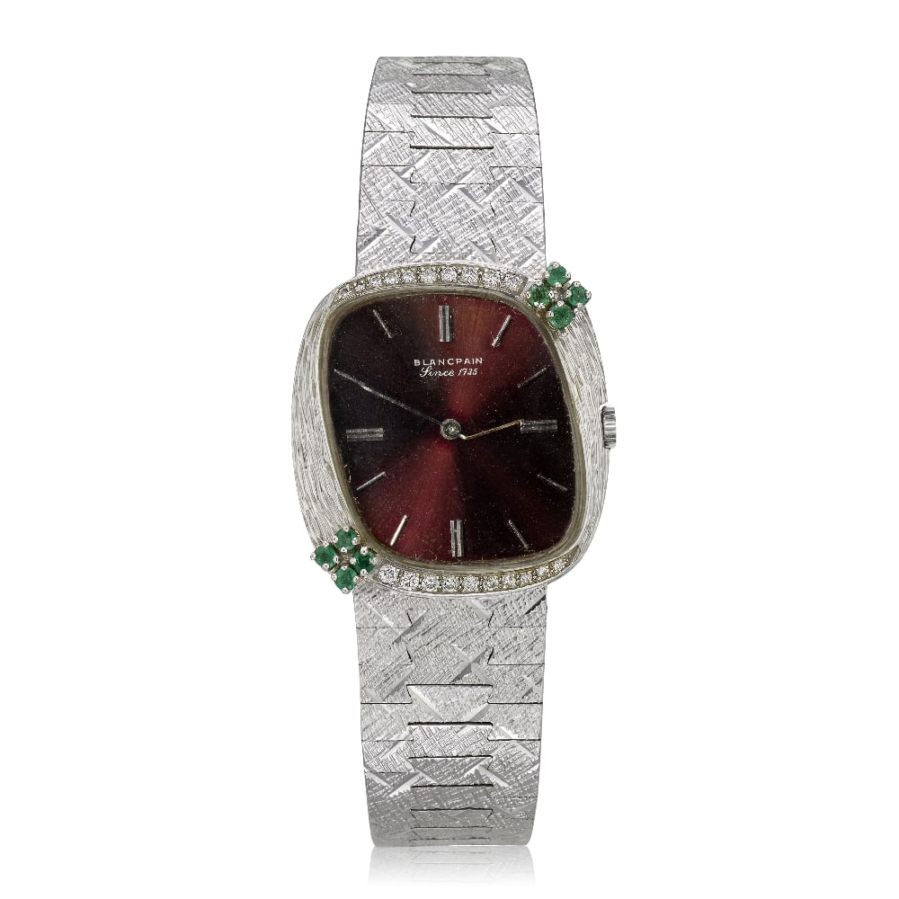 Blancpain. An 18K white gold manual wind bracelet watch with gem-set bezel Circa 1970: Blancpain. An 18K white gold manual wind bracelet watch with gem-set bezel Date: Circa 1970 Movement: 18-jewel manual wind, No.580016 Dial: Maroon sunburst, applied polished baton hour markers, polish