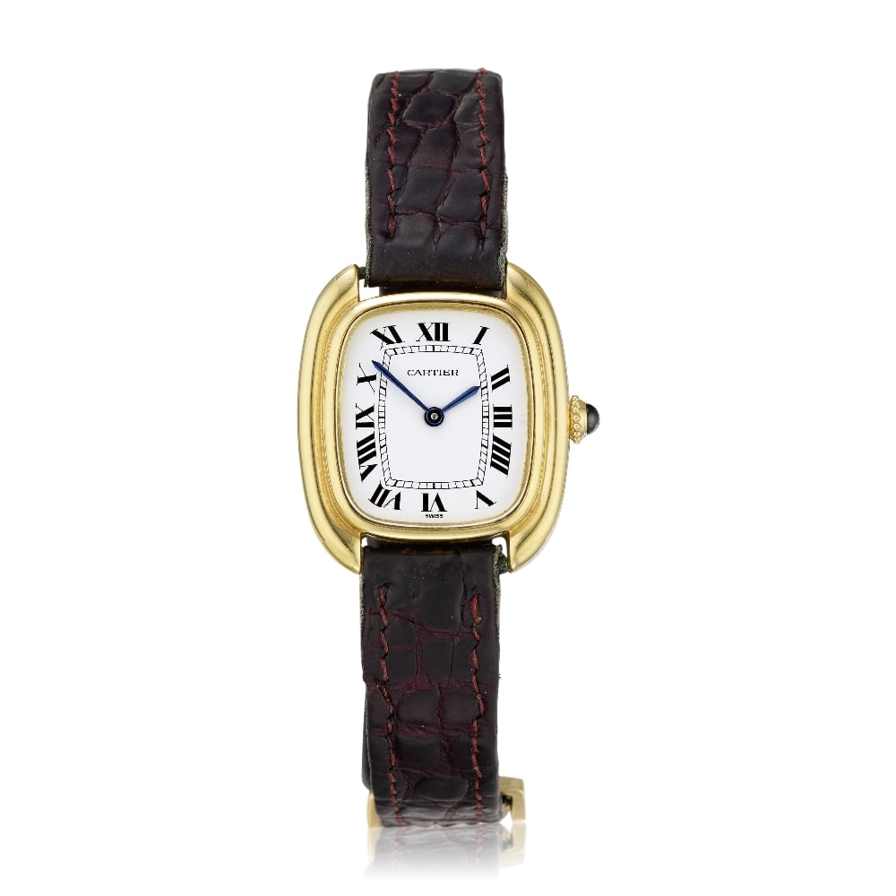 Cartier. A lady's 18K gold manual wind wristwatch Gondole, Ref: 78079, Circa 1980: Cartier. A lady's 18K gold manual wind wristwatch Model: Gondole Reference: 78079 Date: Circa 1980 Movement: 17-jewel manual wind Dial: White, black Roman numeral hour markers, secret signature at 7, 
