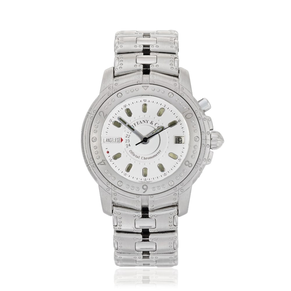 Tiffany & Co. A rare and heavy 18K white gold automatic calendar bracelet watch with world time ...: Tiffany & Co. A rare and heavy 18K white gold automatic calendar bracelet watch with world time indication Model: Streamerica World Time Reference: M1466 Date: Circa 1995 Movement: Jewelled automatic,
