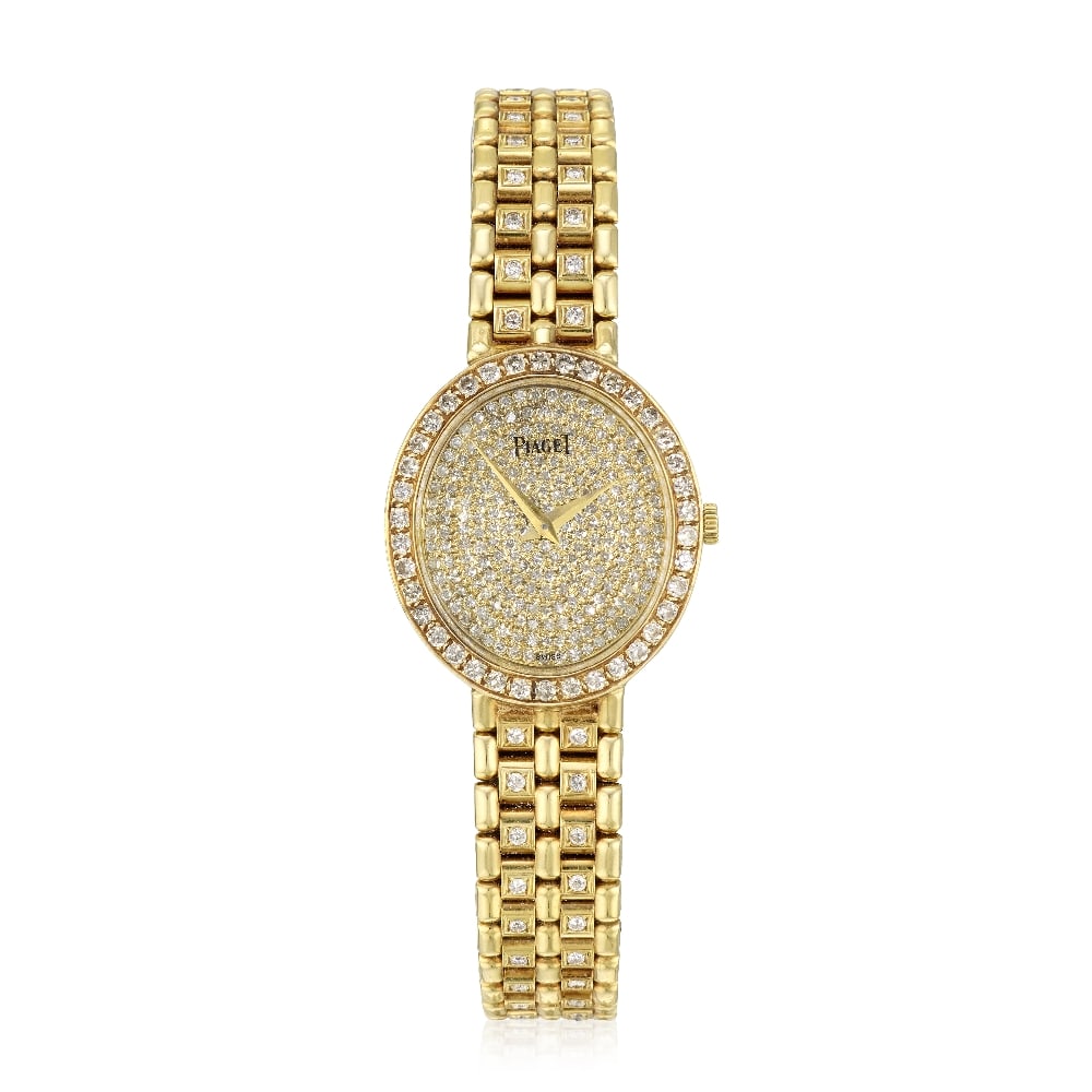 Piaget. A recently serviced lady's 18K gold diamond set manual wind bracelet watch Circa 1990: Piaget. A recently serviced lady's 18K gold diamond set manual wind bracelet watch Date: Circa 1990 Movement: 18-jewel Cal.9P2 manual wind, adjusted to 5 positions & temperature, No.799221 Dial: Diamo