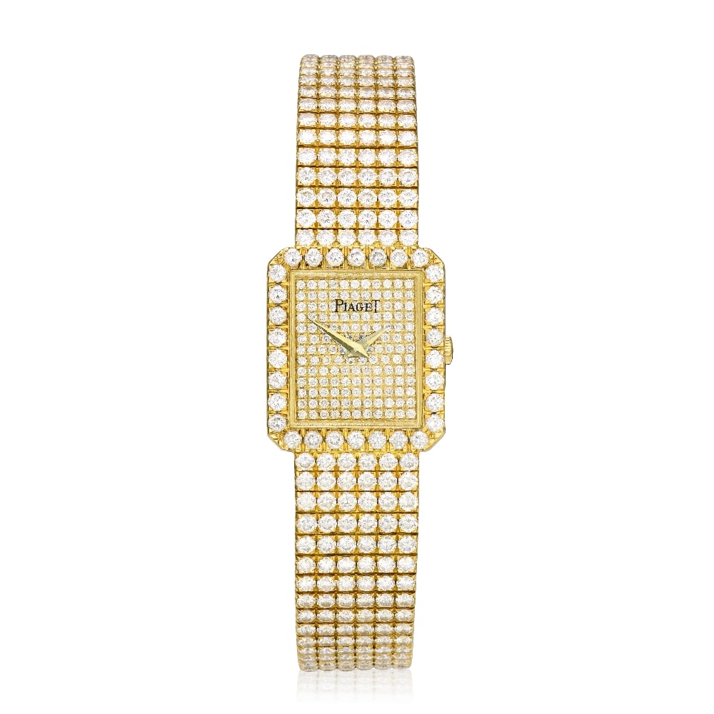 Piaget. A lady's 18K gold diamond set quartz bracelet watch Ref: 83541 C626, Circa 2005: Piaget. A lady's 18K gold diamond set quartz bracelet watch Reference: 83541 C626 Date: Circa 2005 Movement: 4-jewel Cal.857P quartz Dial: Diamond set, gilt lance hands Case: Brushed and polished rect