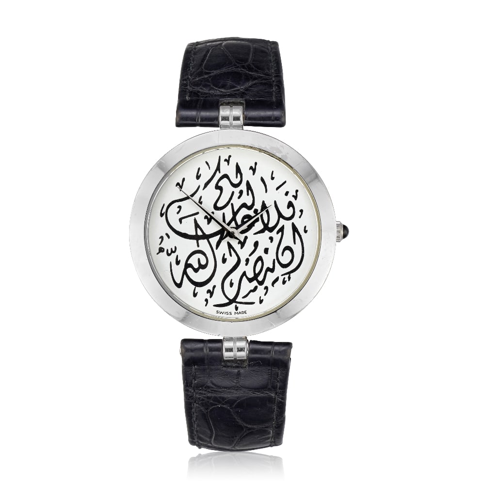 Montega. An 18K white gold quartz wristwatch Circa 2000: Montega. An 18K white gold quartz wristwatch Date: Circa 2000 Movement: 6-jewel ETA quartz Dial: White with Arabic script, polished sword hands Case: Brushed and polished round, back secured by 6 scre