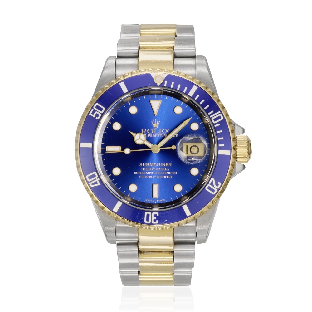 Rolex. A stainless steel and gold automatic calendar bracelet watch Submariner, Ref: 16613, Pur...: Rolex. A stainless steel and gold automatic calendar bracelet watch Model: Submariner Reference: 16613 Date: Purchased 18th November 2000 Movement: 31-jewel Cal.3135 automatic, adjusted to 5 positions
