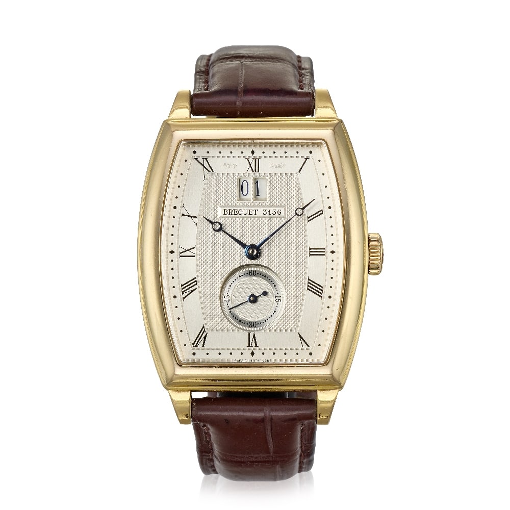 Breguet. An 18K gold automatic calendar wristwatch Ref: 5480, Circa 2005: Breguet. An 18K gold automatic calendar wristwatch Reference: 5480 Date: Circa 2005 Movement: 30-jewel Cal.516GG automatic, No.01268 Dial: Guilloché engraved silvered, black Roman numeral hour ma