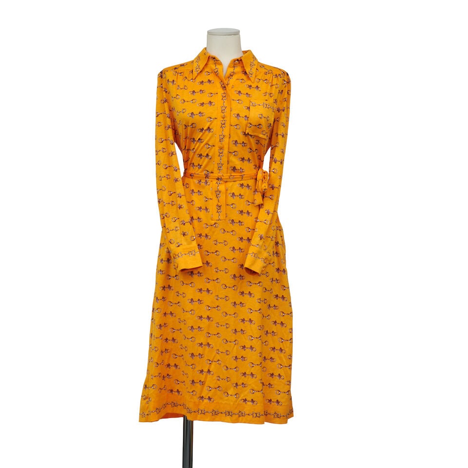 Hermès Paris, circa 1980. Robe en jersey jaune à motif de mors. Hermès Paris, cir...: Hermès Paris, circa 1980. Robe en jersey jaune à motif de mors. Hermès Paris, circa 1980. Yellow jersey dress with horsebit motif. Condition grade: B Taille indiquée/indicated