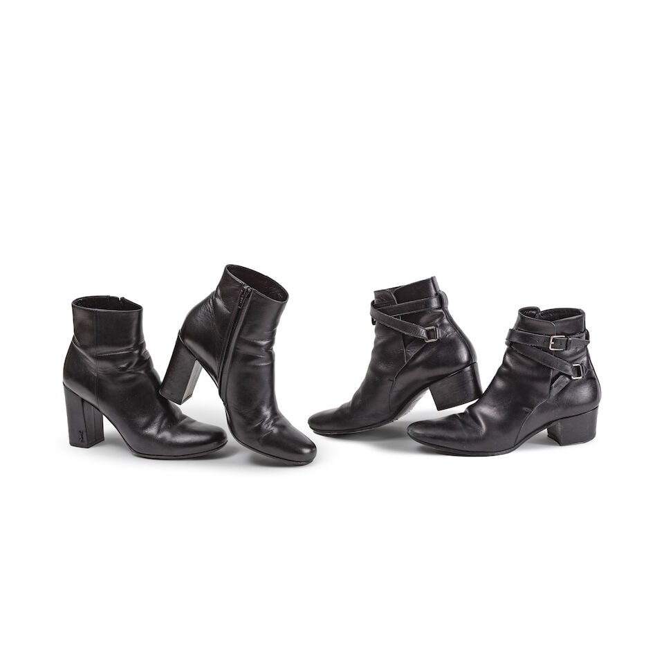 Saint Laurent Paris. Deux paires de bottines à talons en cuir noir. Saint Laurent Paris. Tw...: Saint Laurent Paris. Deux paires de bottines à talons en cuir noir. Saint Laurent Paris. Two pairs of black leather heeled ankle boots. Pointure indiquée/Size indicated: 38. Footnotes: Bon