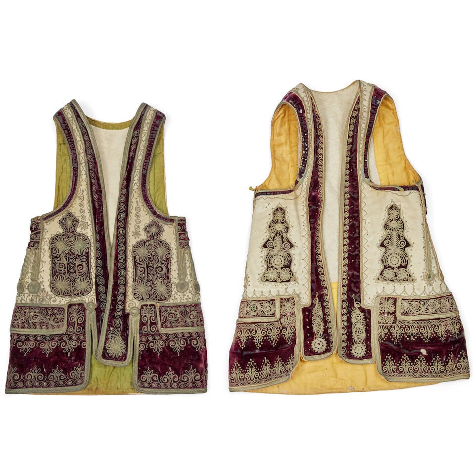 A selection of late 19th century Greek or Turkish dress (6): A selection of late 19th century Greek or Turkish dress Comprising two adult black and cream fabric vests, two red and cream waistcoats and two black and golden child's waistcoats, all with foliate