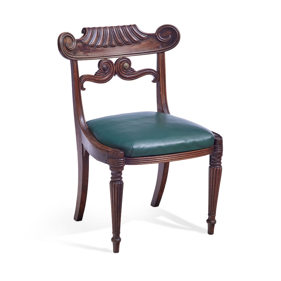 A Regency mahogany chairEarly 19th century: A Regency mahogany chair Early 19th century Of large proportions, the scrolled and moulded top rail above moulded uprights and scrolled back rails above moulded and curved side rails with a drop-in