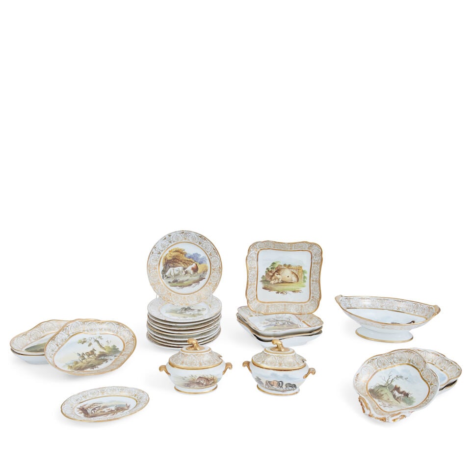 An English porcelain dessert service Early 19th century: An English porcelain dessert service Early 19th century With gilt borders, painted to the centre with farm animals, hounds, rabbits, etc. in natural settings within gilt anthemion borders, unmarked,