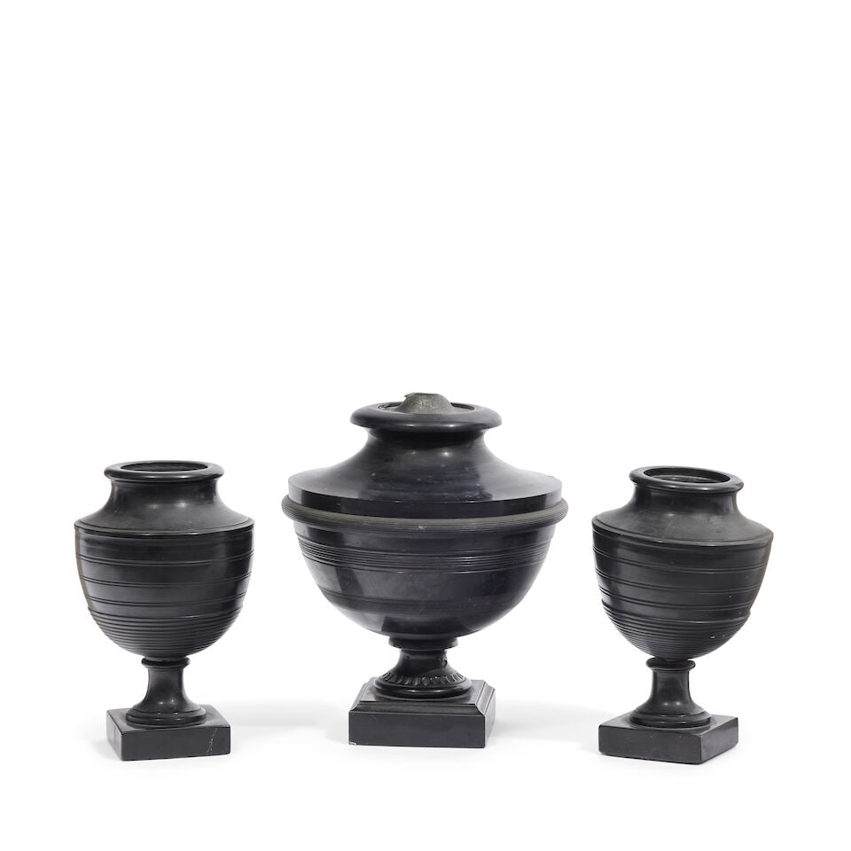 A pair of parrot coal urns 19th century (3): A pair of parrot coal urns 19th century Each with turned socle and square base, inscribed with a rectangular cartouche 'W MALFASS' together with a larger example converted to an electric lamp, the
