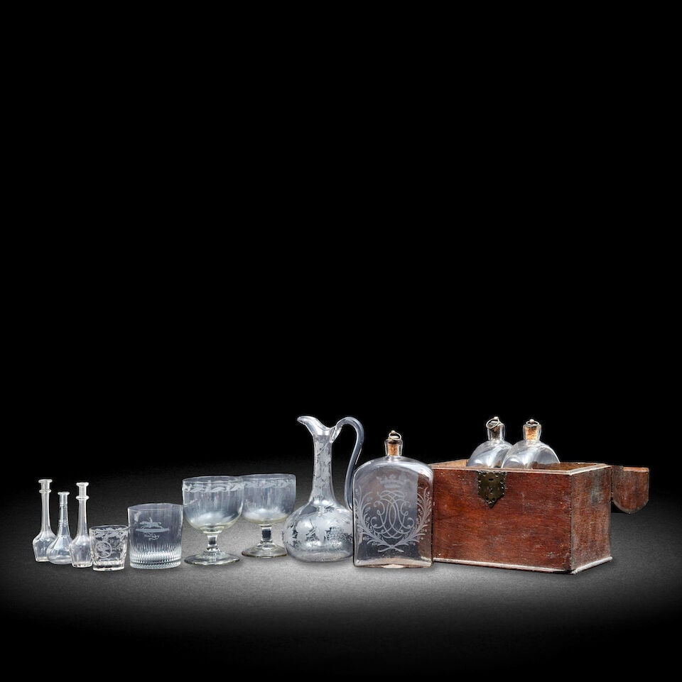 A collection of glassware: A collection of glassware Including a Victorian tumbler engraved with the Maxwell crest, monogram 'WM' and dated 1844, flanked by a thistle and rose spray, 7.5cm high; a George III tumbler engraved wi