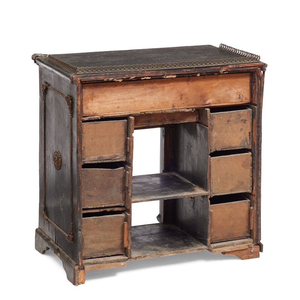 A George II and later ebonised and gilt metal mounted kneehole desk Second quarter 18th century ... - 2