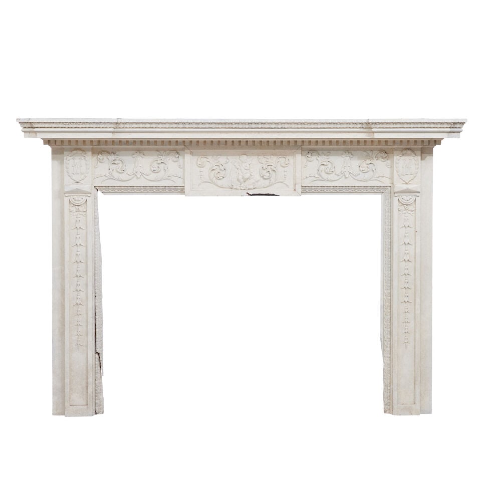 A large carved pine and gesso cream-painted fire surround in the George II style Late 19th century: A large carved pine and gesso cream-painted fire surround in the George II style Late 19th century The inverted breakfront stiff leaf carved cornice above a dental moulded frieze and a central 'tablet