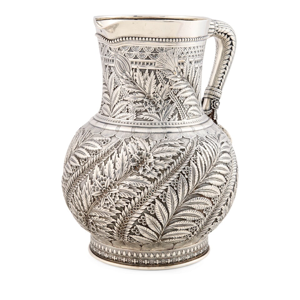 Tiffany & Co. Sterling Silver Pitcher,: Tiffany & Co. Sterling Silver Pitcher, New York, 1873-91, marked 3612/8129, with allover chased Persian style motif foliate palms and flowers and a cast elephant head to lower handle joint, height 9 1