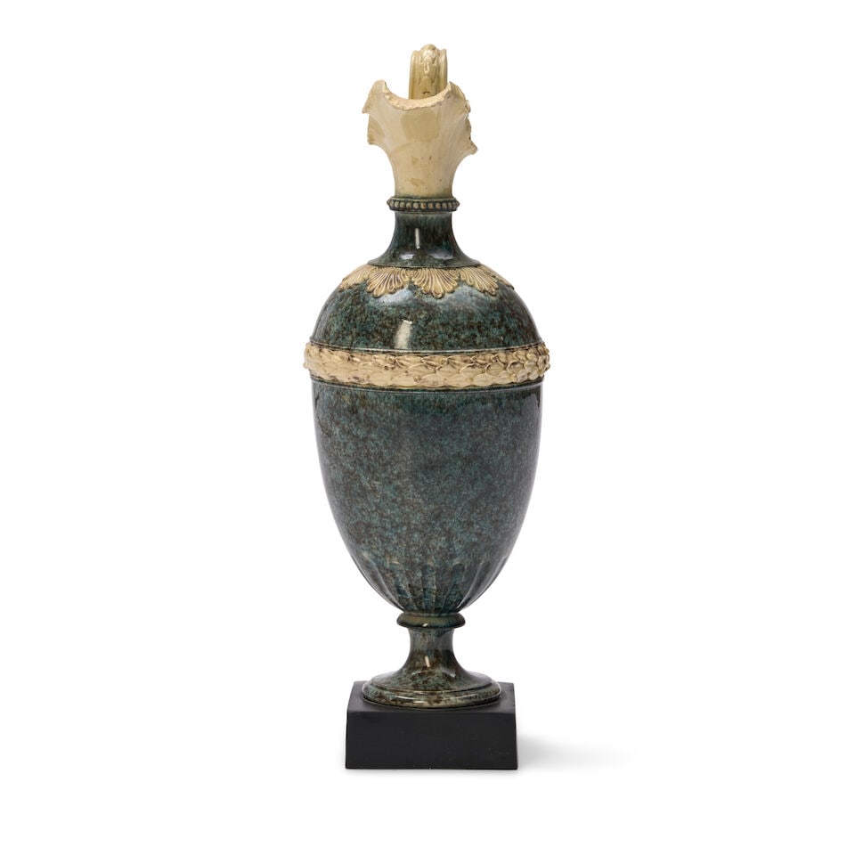 Wedgwood & Bentley Variegated Ewer, England, c. 1770,: Wedgwood & Bentley Variegated Ewer, England, c. 1770, with white terra cotta spout scrolled handle and Baccus mask head terminal, and with a laurel and berry banding, mounted atop a black basalt plint