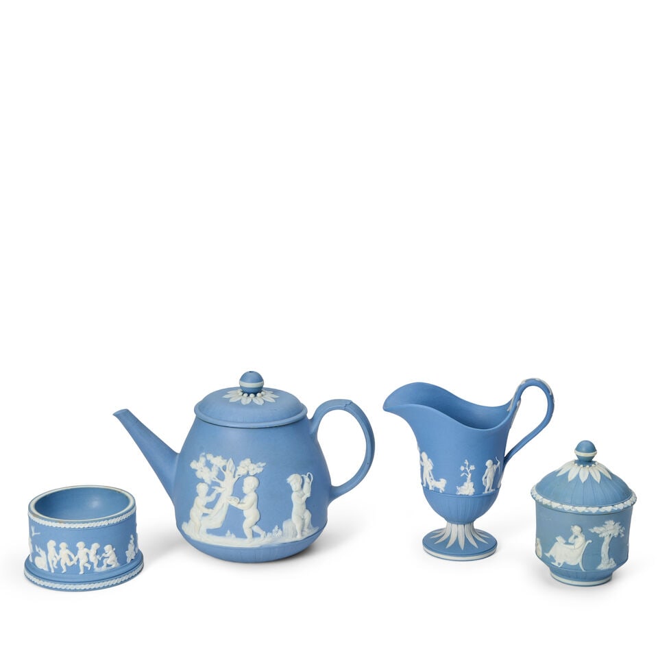 Four Wedgwood Solid Blue Jasper Items, England, late 18th/early 19th century,: Four Wedgwood Solid Blue Jasper Items, England, late 18th/early 19th century, each with applied white classical figures in relief, including a master salt, dia. 3 1/4; helmet-shaped creamer, ht. 5 1/4