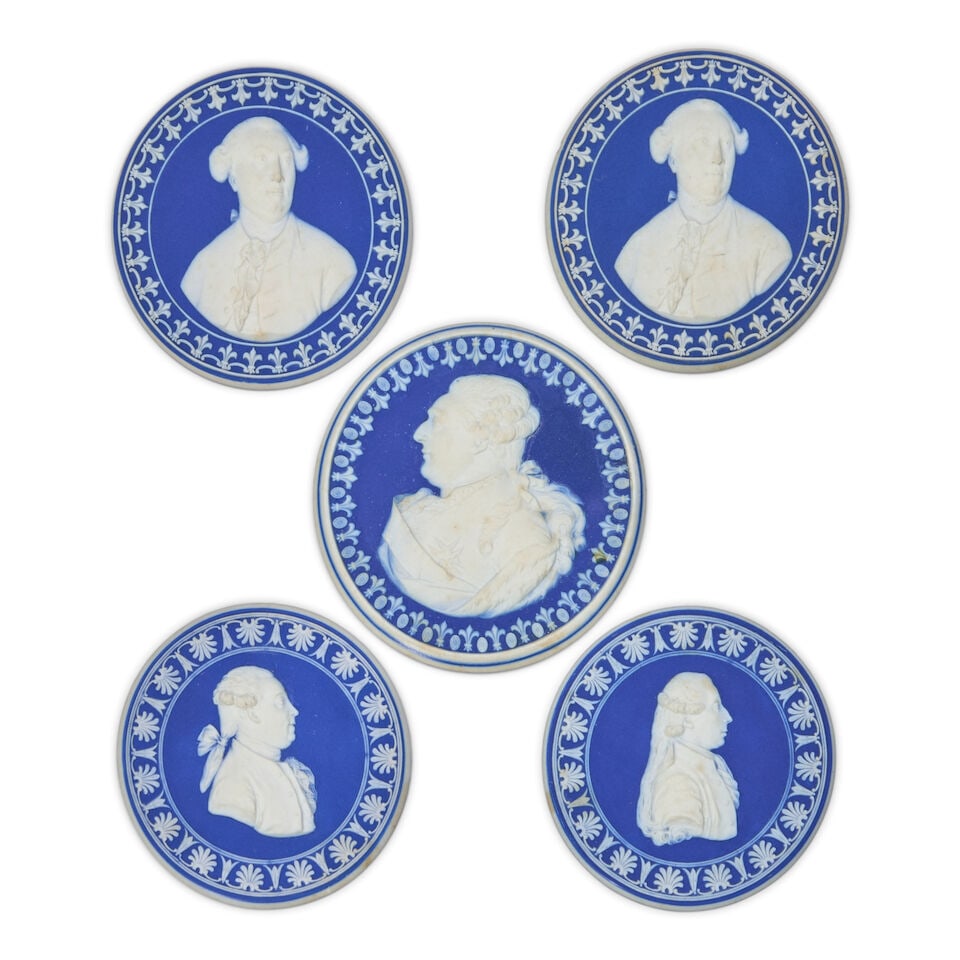 Five Wedgwood Dark Blue Jasper Dip Polished Edge Portrait Medallions, England, late 18th century,: Five Wedgwood Dark Blue Jasper Dip Polished Edge Portrait Medallions, England, late 18th century, each with applied white relief foliate borders and central portraits, including four 2 3/8 dia., (2) J
