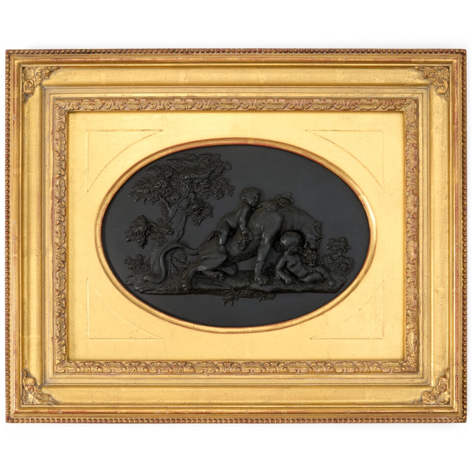 Wedgwood Black Basalt Oval Plaque, England, 19th century,: Wedgwood Black Basalt Oval Plaque, England, 19th century, high relief depiction of the Panther and Bacchanalian Boys, by sight 7 x 10 1/2; set in a gilt wood frame, 14 1/2 x 17 3/4 in. Footnotes: Prov