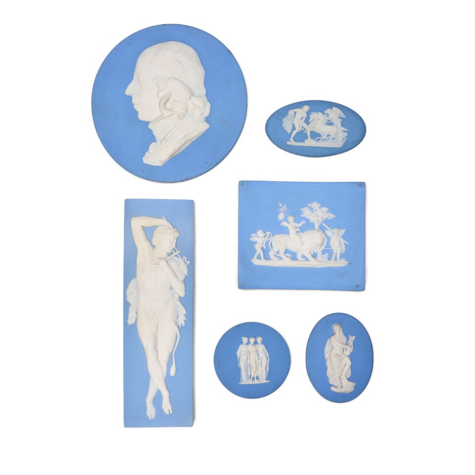 Six Wedgwood Solid Blue Jasper Medallions/Plaques, England, 19th century,: Six Wedgwood Solid Blue Jasper Medallions/Plaques, England, 19th century, each with applied white relief, including a roundel portrait of Flaxman, dia. 5 3/4; two ovals with classical figures, lg. 3 1