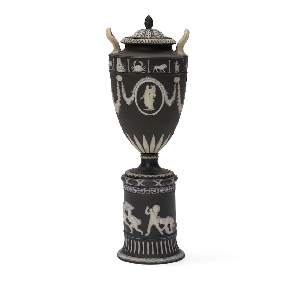 Wedgwood Solid Black Jasper Vase and Cover, England, c. 1900,: Wedgwood Solid Black Jasper Vase and Cover, England, c. 1900, applied white relief including a band of zodiac motifs over classical medallions, the drum base with depiction of Blind Man's Bluff, ht. 1