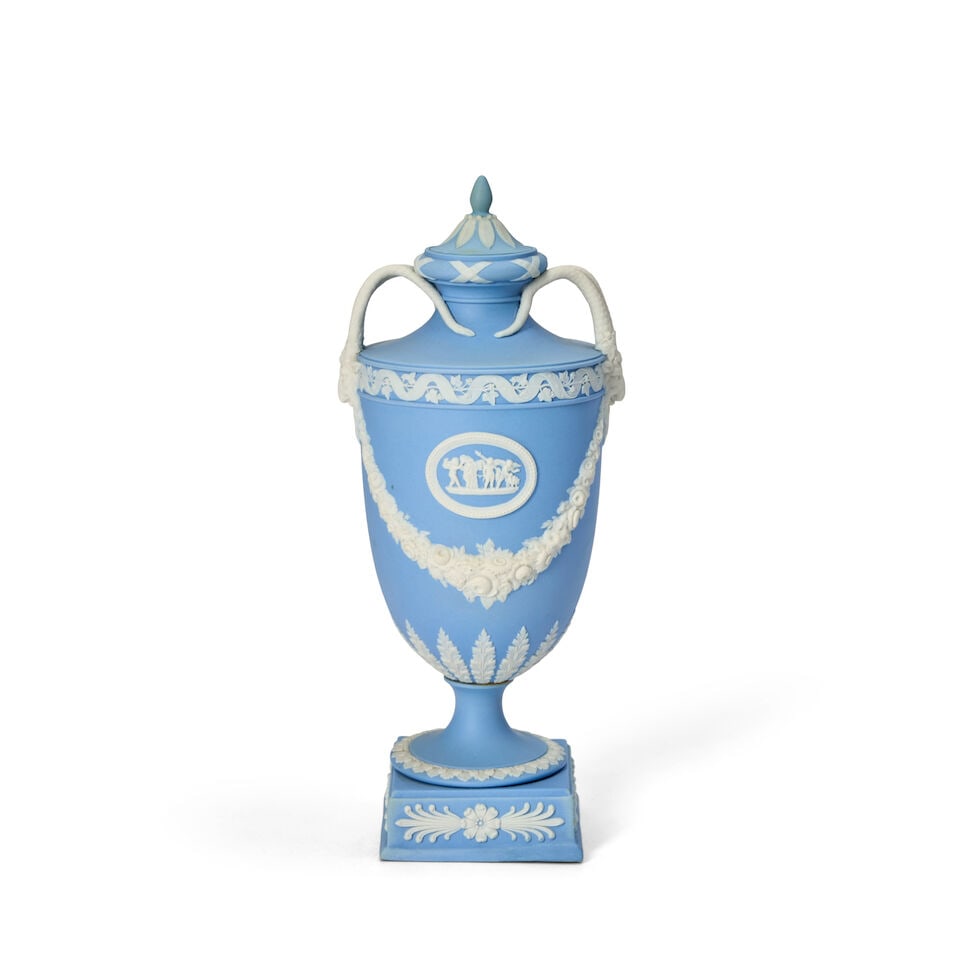 Wedgwood Solid Light Blue Jasper Vase and Cover, England, 19th century,: Wedgwood Solid Light Blue Jasper Vase and Cover, England, 19th century, applied white relief with classical medallions above floral festoons, goat mask and horn handles, impressed mark, ht. 10 in. Foo