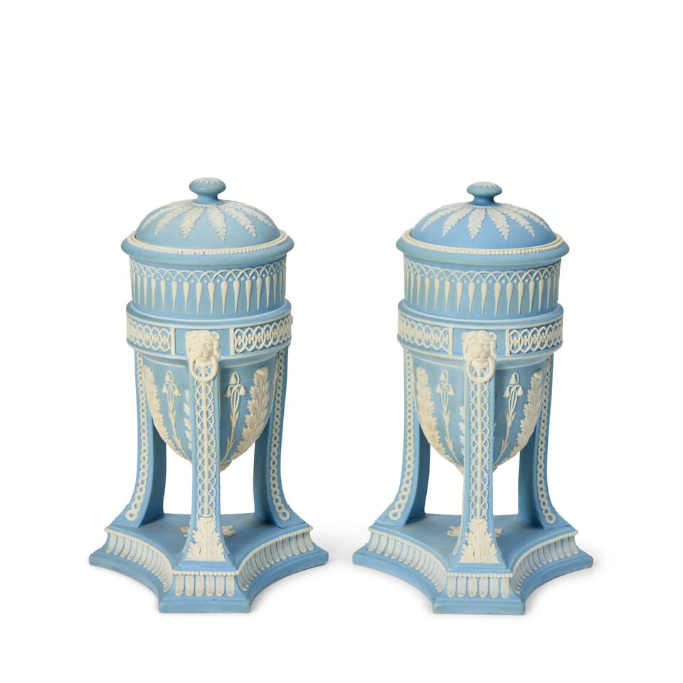Pair of Wedgwood Light Blue Jasper Dip Tripod Vases and Covers, England, late 19th century,: Pair of Wedgwood Light Blue Jasper Dip Tripod Vases and Covers, England, late 19th century, each with applied white acanthus and bell flowers to the bowl and with varying foliate design borders, all a