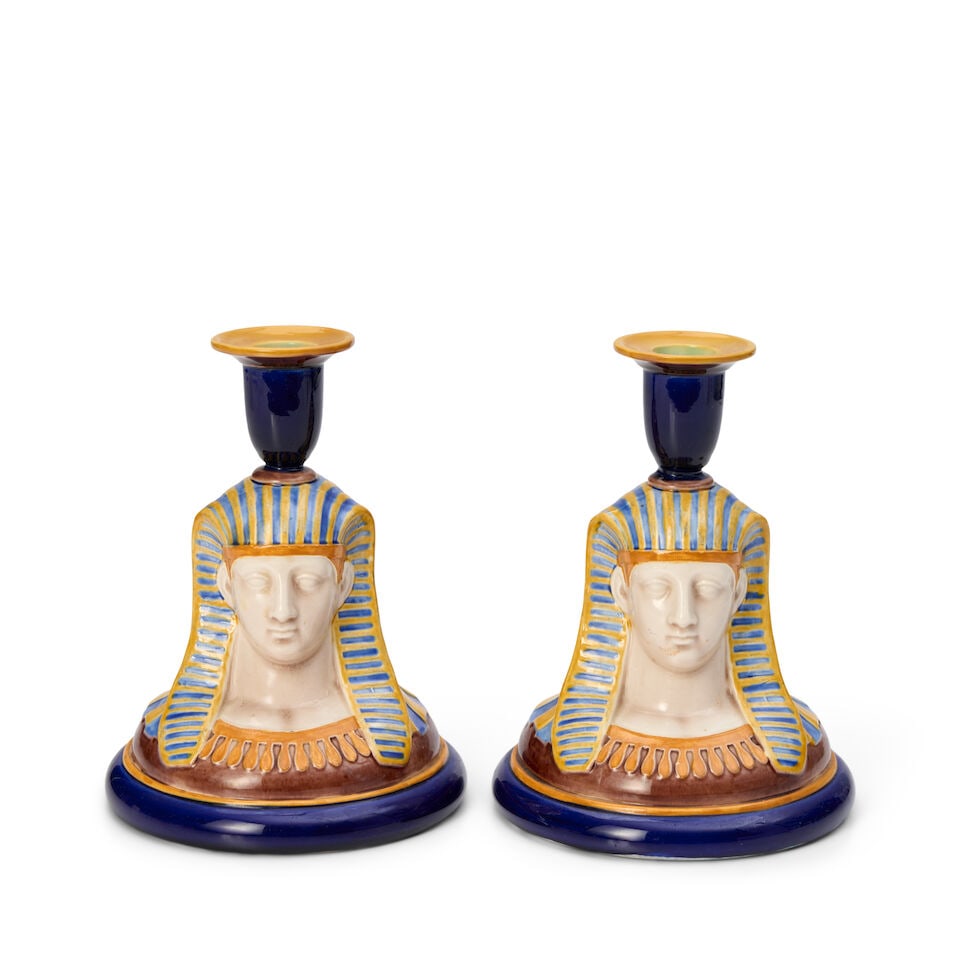 Pair of Wedgwood Majolica Sphinx Candlesticks, England, c. 1869,: Pair of Wedgwood Majolica Sphinx Candlesticks, England, c. 1869, polychrome decorated and modeled with a candle nozzle atop the head, impressed mark, ht. 6 3/4 in. Footnotes: Provenance Faith and Bruc