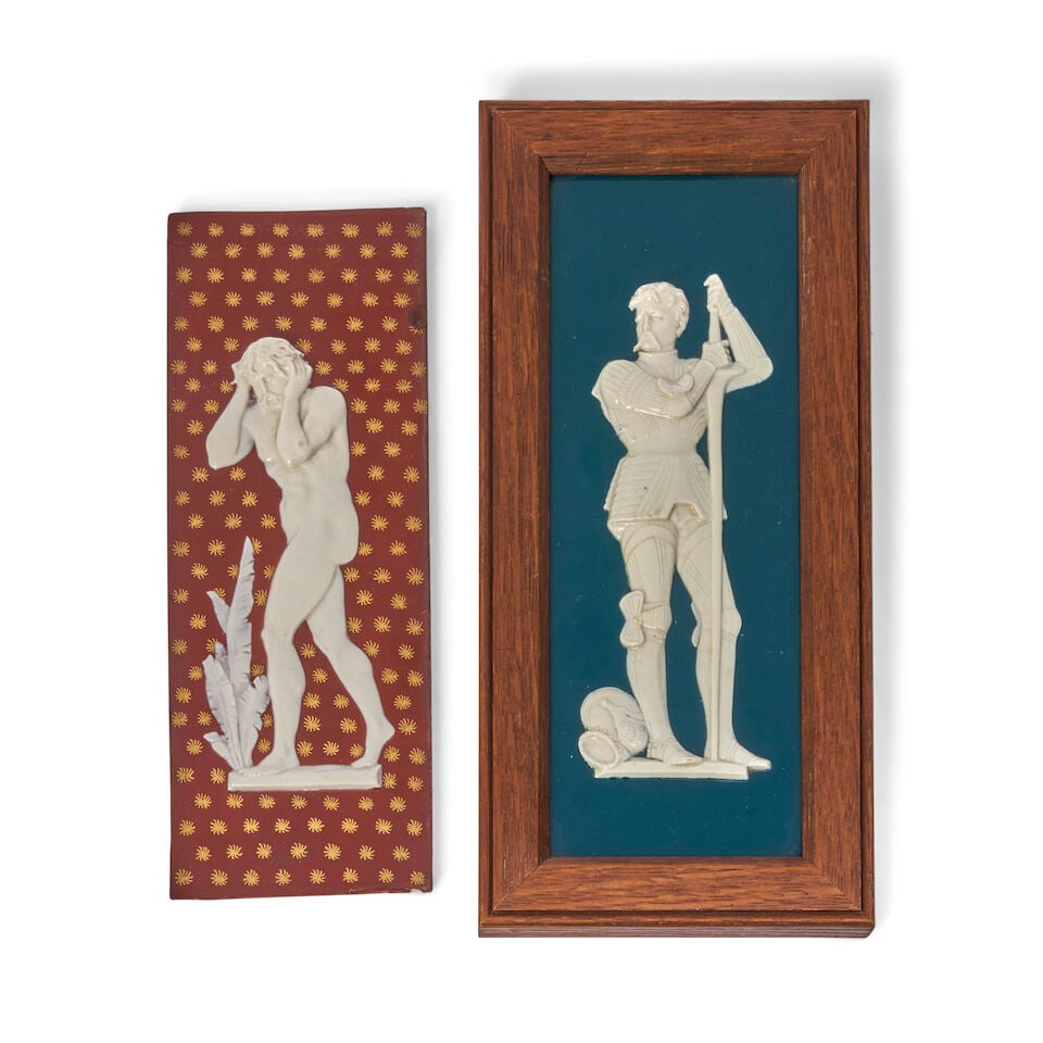 Two Wedgwood Victoria Ware Tiles, England, last quarter 19th century,: Two Wedgwood Victoria Ware Tiles, England, last quarter 19th century, each rectangular and with white relief, one with a teal blue ground and knight subject, set in an oak frame, overall 5 1/4 x 11 1/