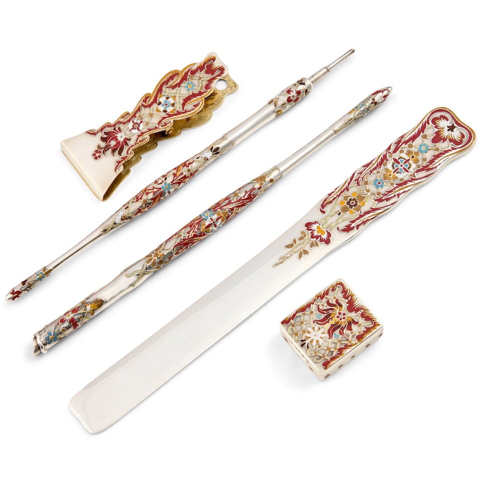 Tiffany & Co. Sterling Silver and Enamel Desk Set,: Tiffany & Co. Sterling Silver and Enamel Desk Set, New York, c. 1885, comprised of a retractable pencil, ink pen, stamp box, paper clip, and paper knife, each with red, yellow, and orange enamel offse